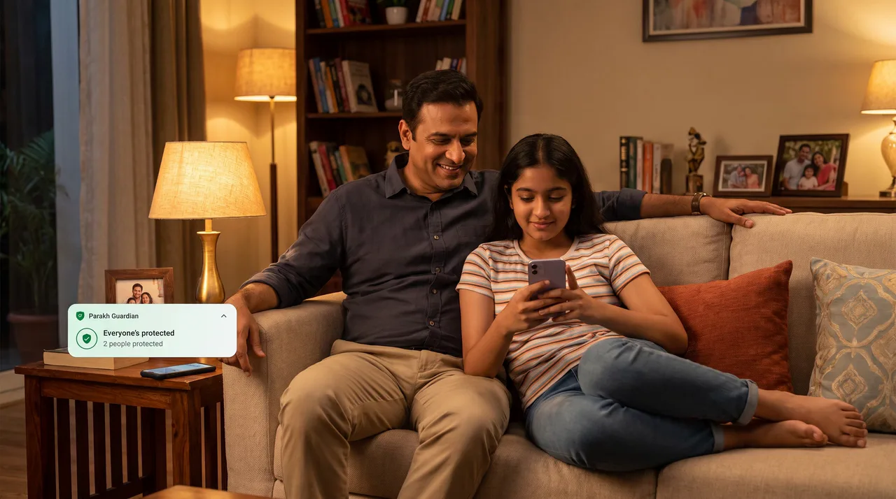 A father and daughter relax on a sofa while a Parakh Guardian notice says everyone in the family is protected.